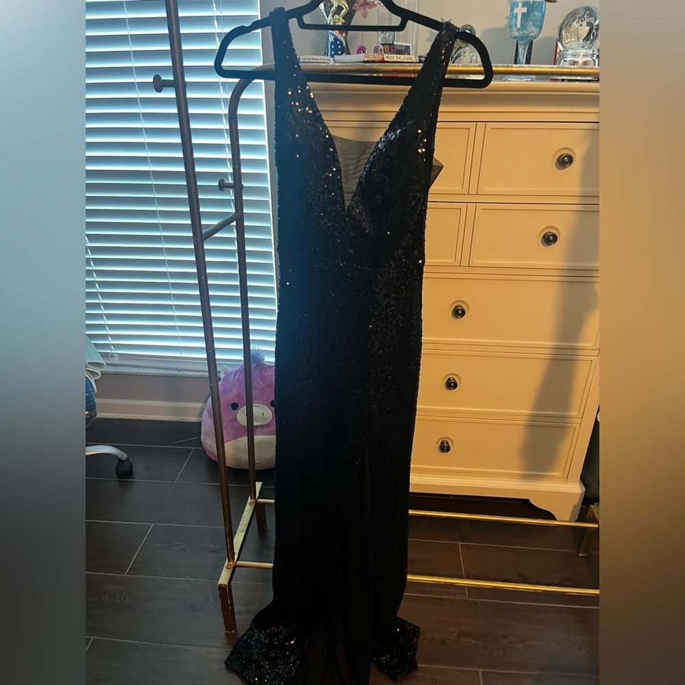 Beautiful black sequins dress. Only worn once size 1/2
